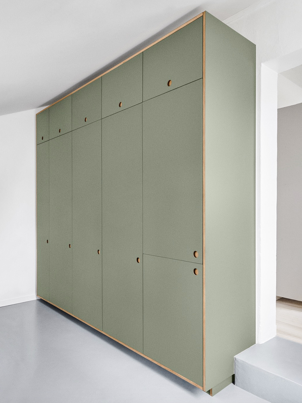 green kitchen tall cupboards