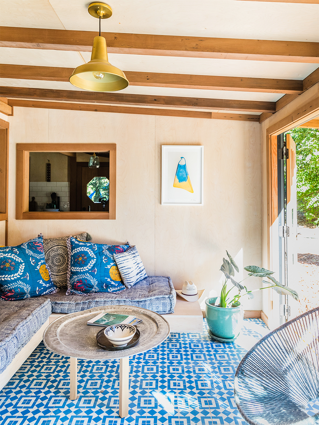 sunroom with blue tile floors