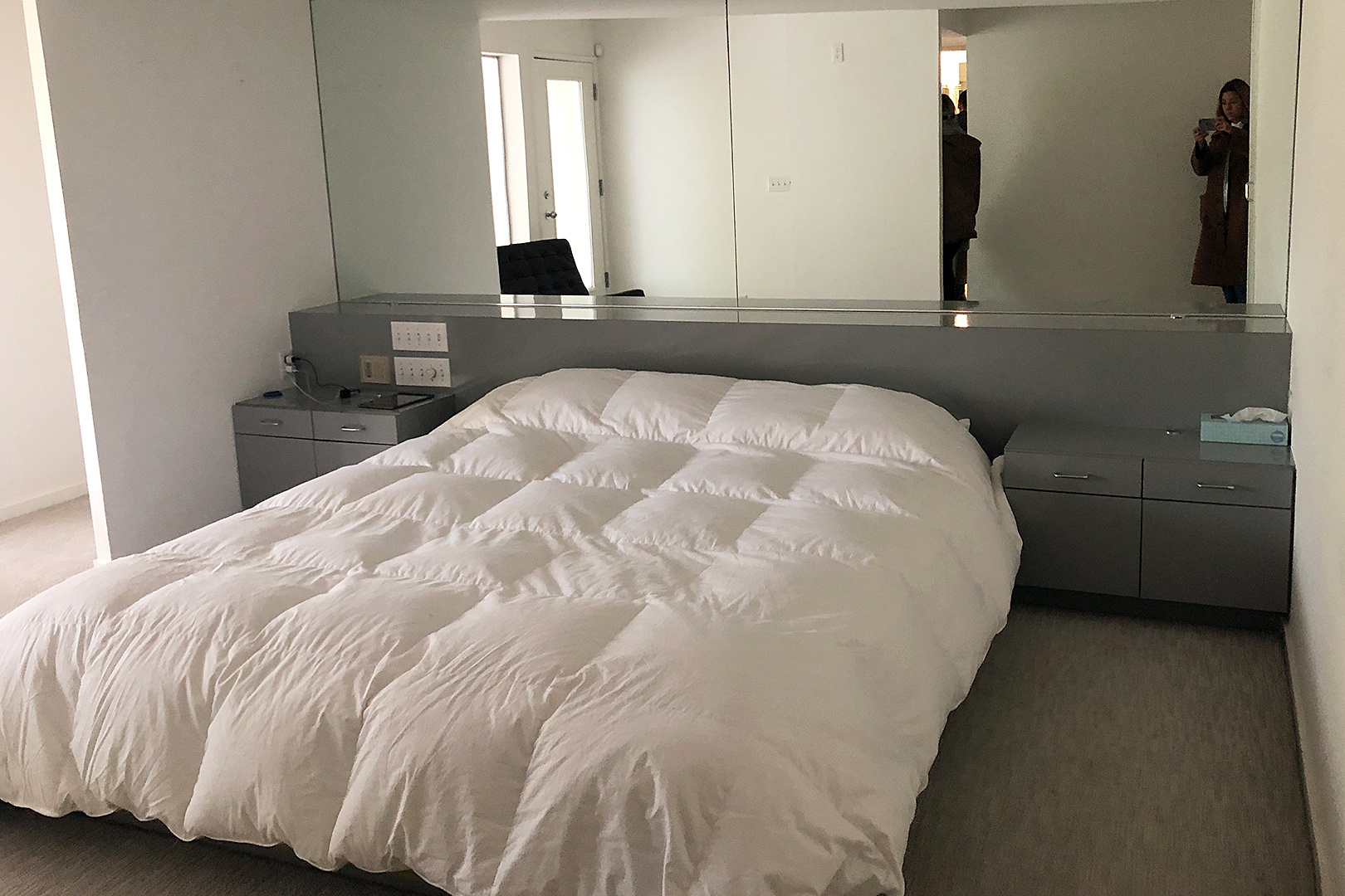 dated bedroom with laminate built-in headboard