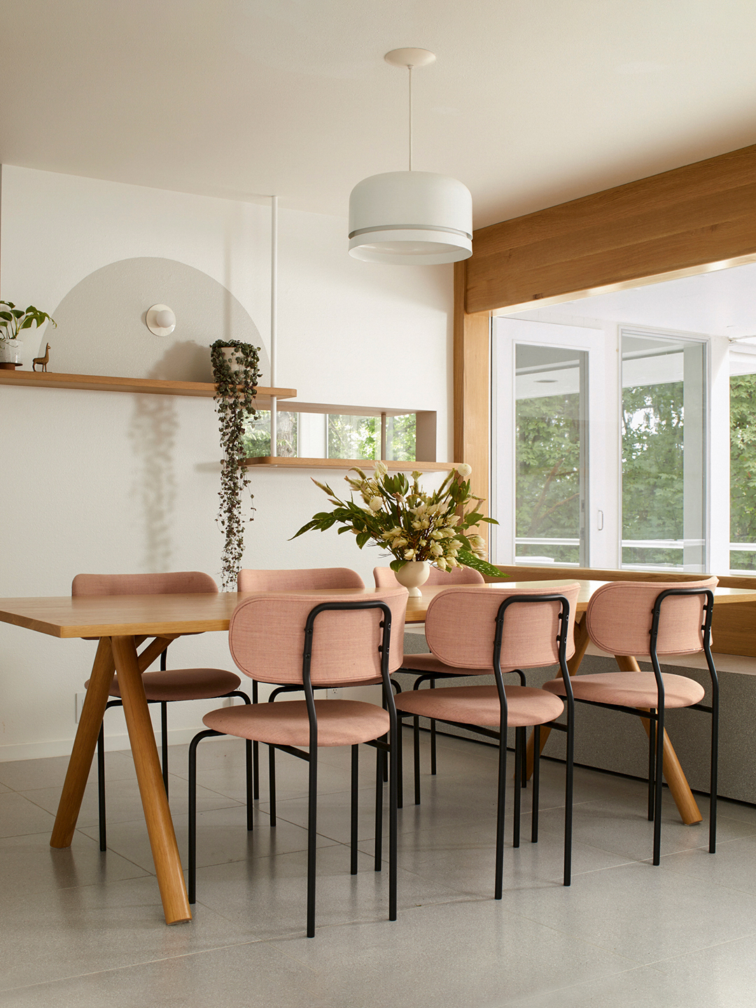 dining room with pink chairs