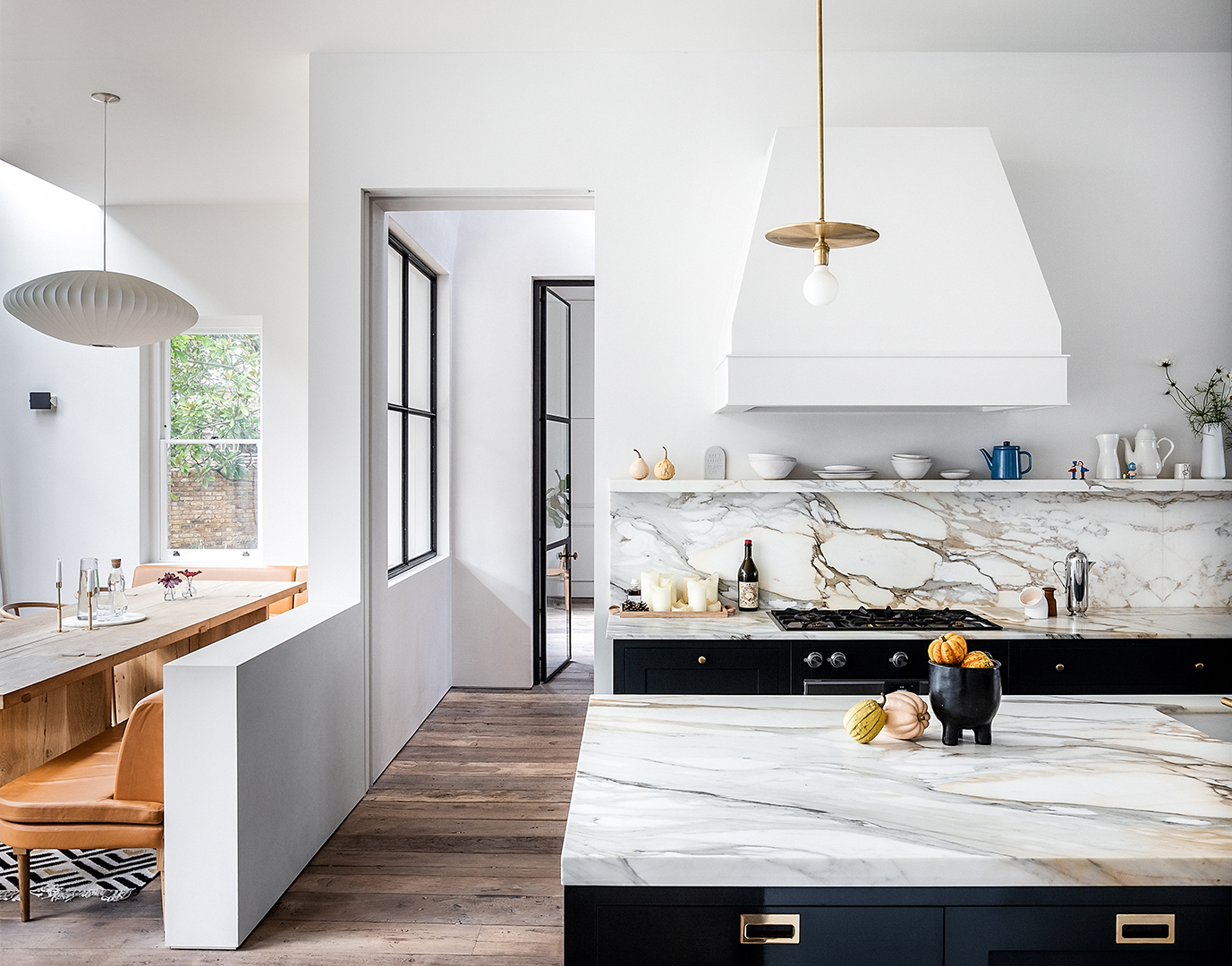 kitchen wiht half wall separating dining area