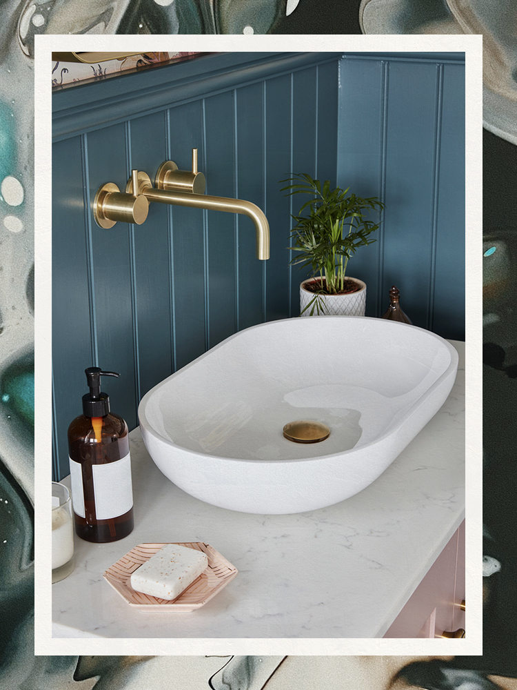 Blue Panel Bathroom with Brass Hardware Sink