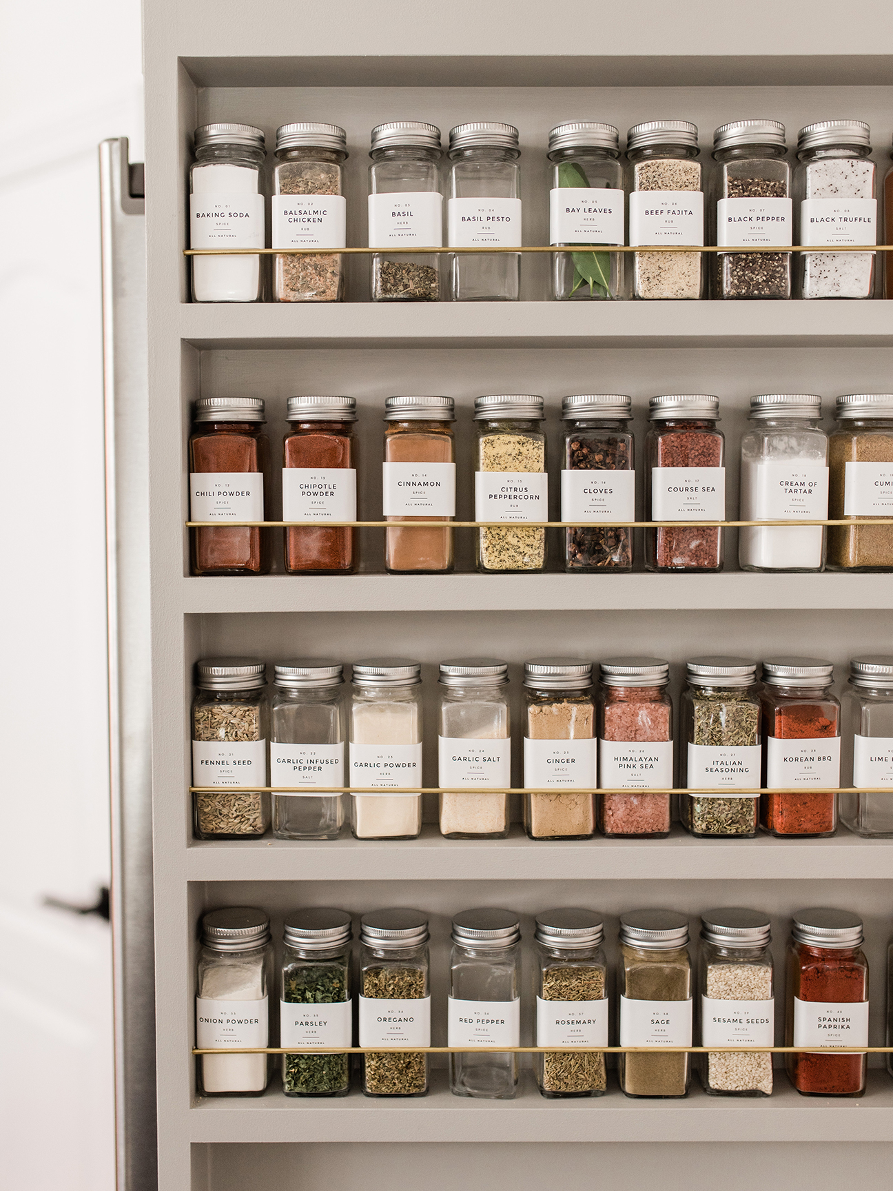 spices lined up on door