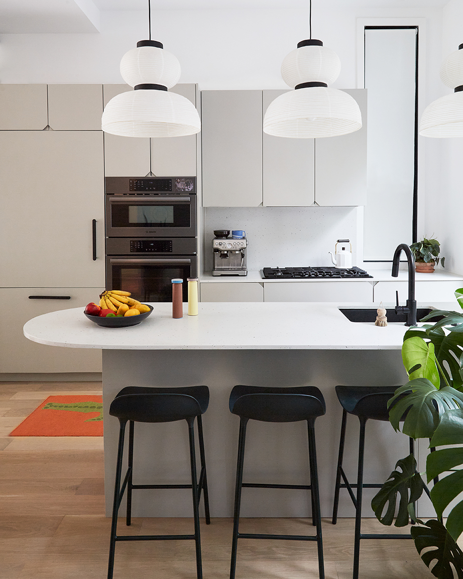 White walls and light gray kitchen cabinetry