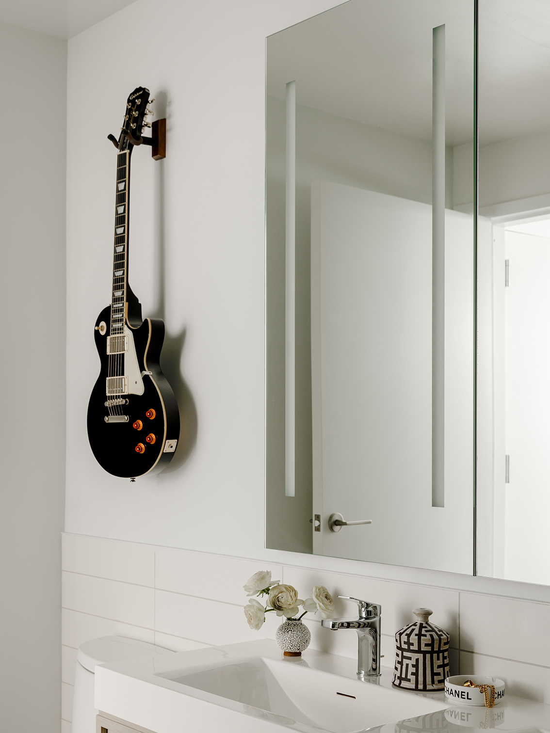 guitar hanging in bathroom