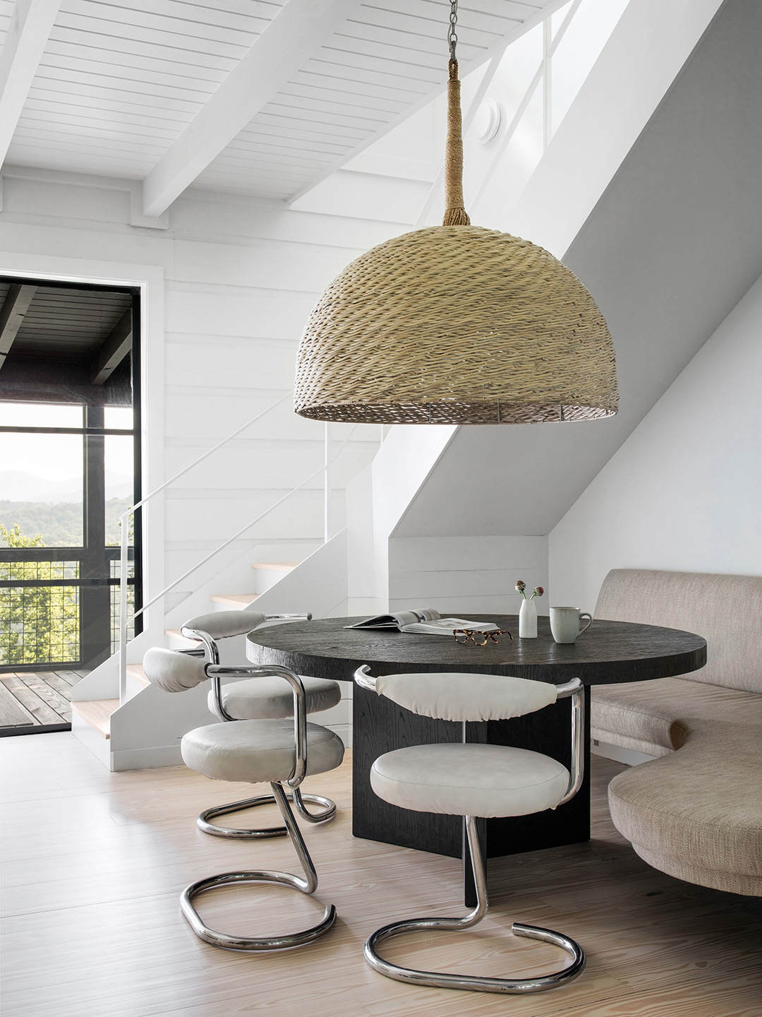 large woven light over dining table