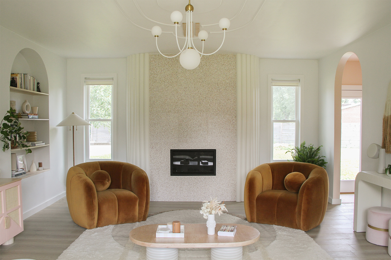 brown side chairs by fireplace