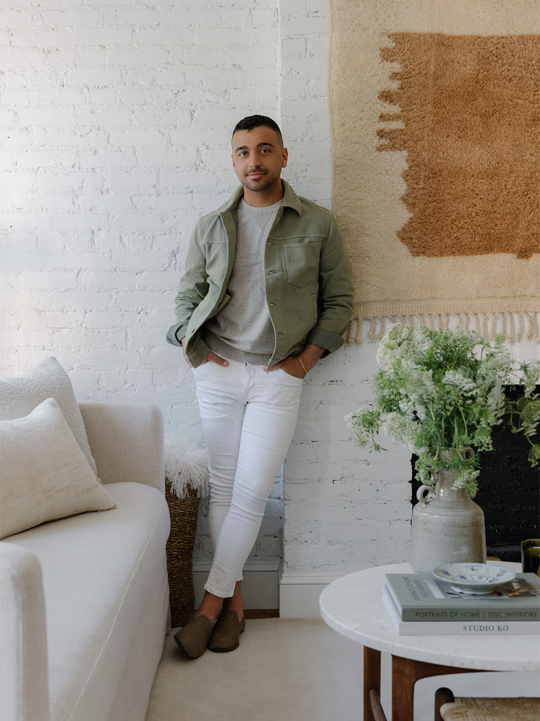 man leaning on wall