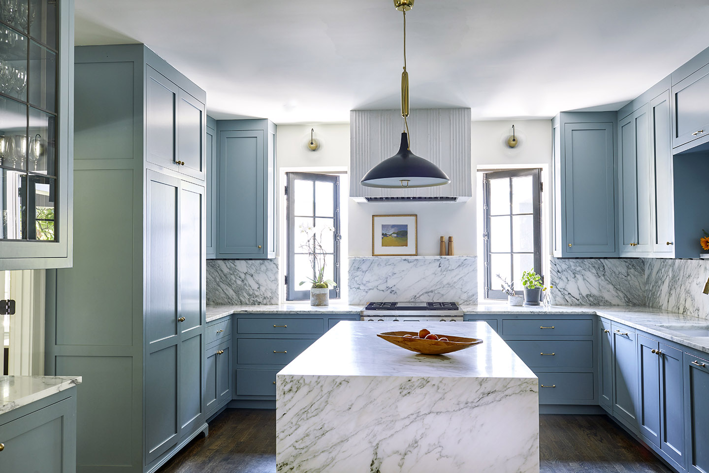 sky blue kitchen with marble island