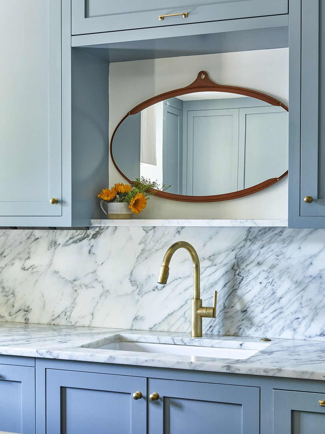 marble sink with mirror above