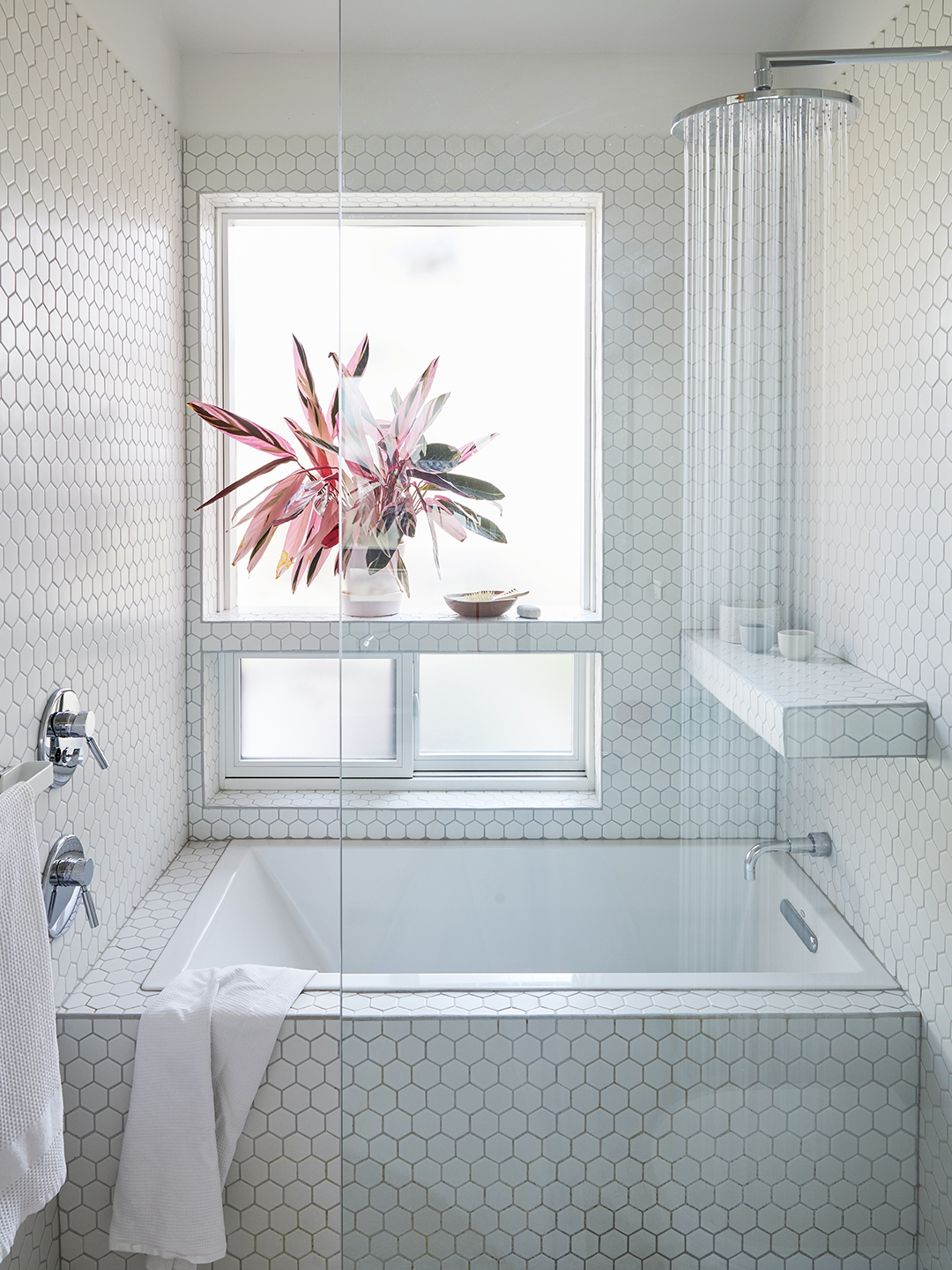 white tiled bathroom tub shower