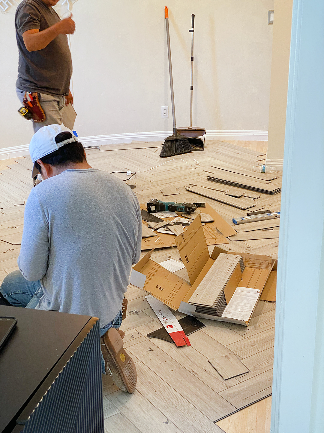 men setting up flooring 