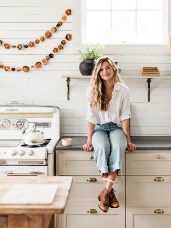 woman in white vintage kitchen