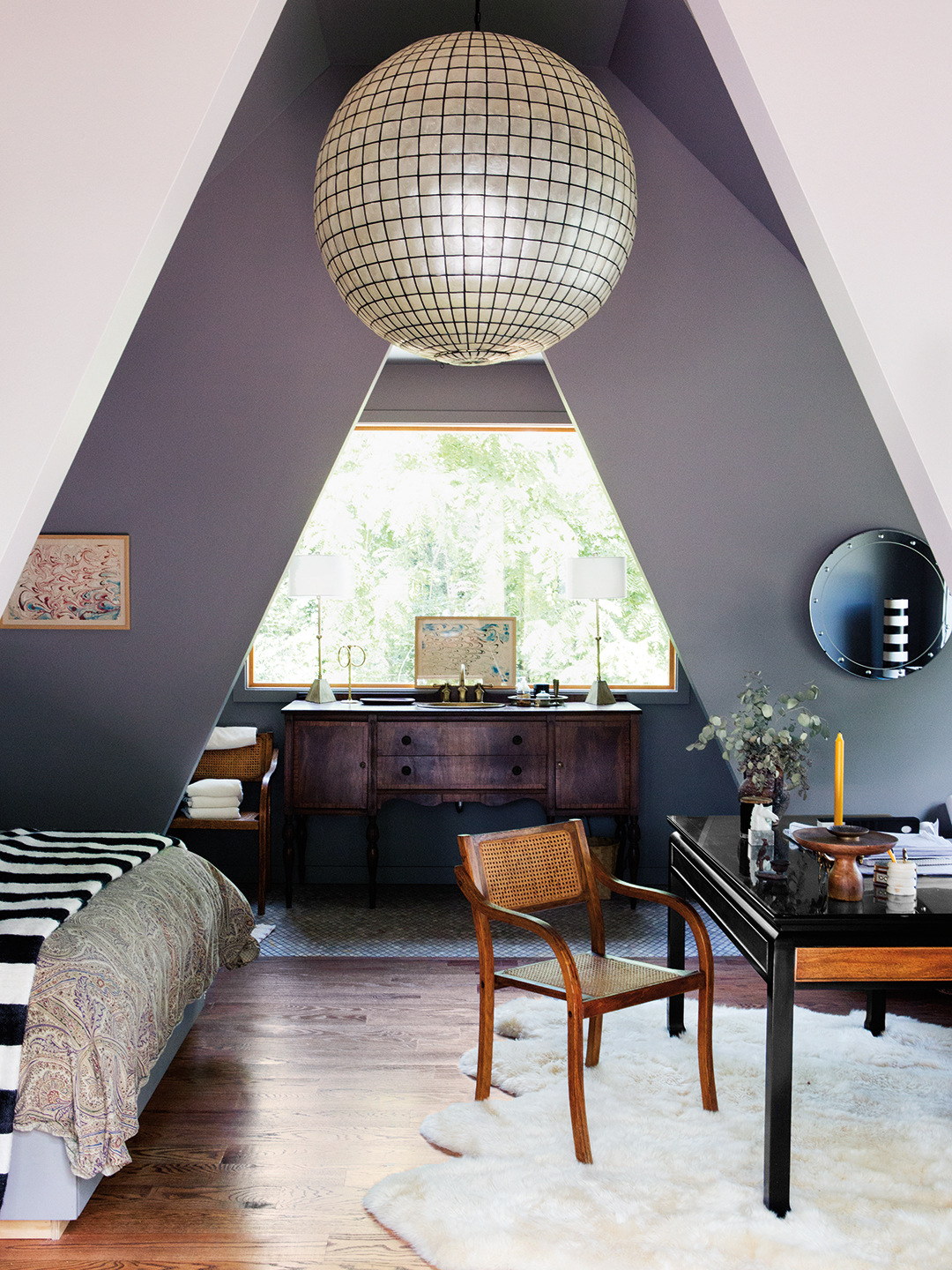 gray bedroom with triagnel ceilings