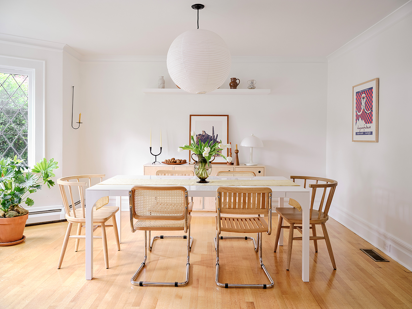 dining room with round paper light