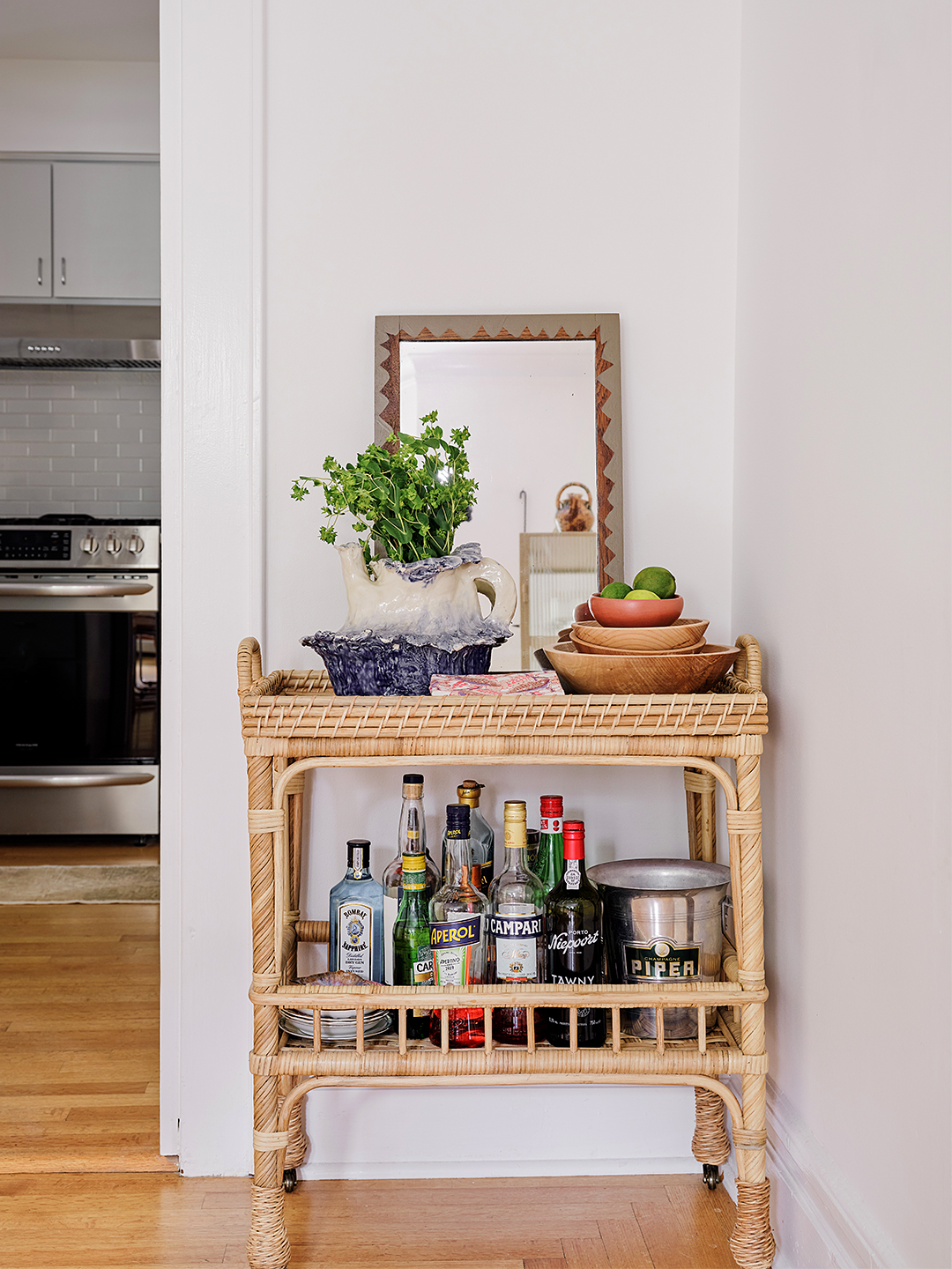 rattan bar cart in corner