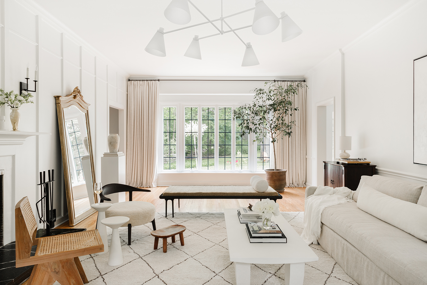 white living room and white chandelier