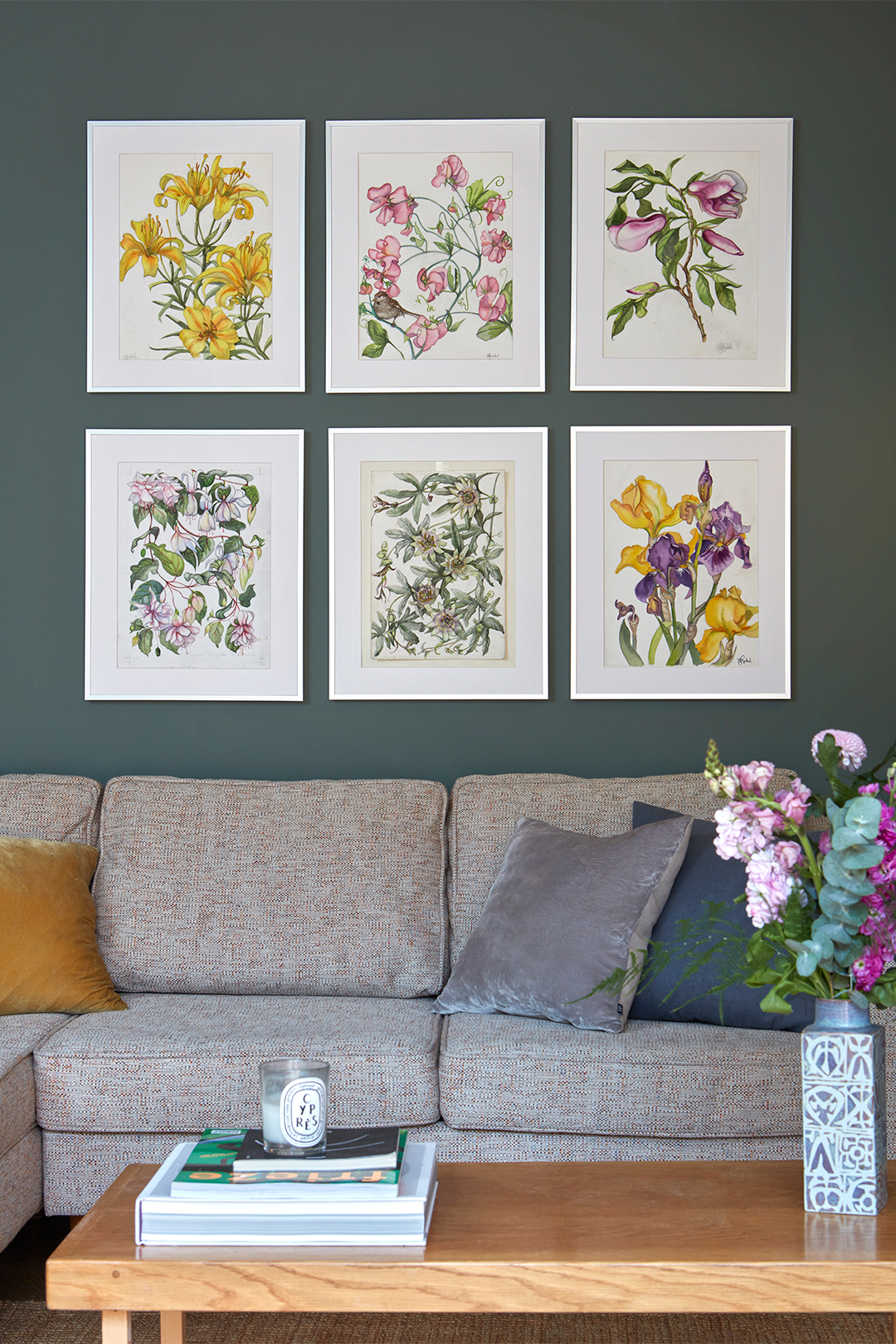 botanical prints on green wall