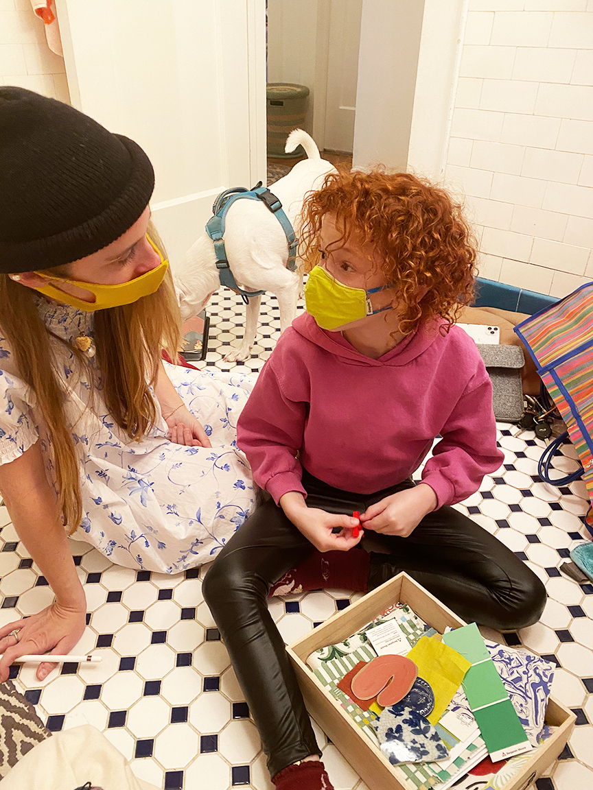 woman talking to kid on floor