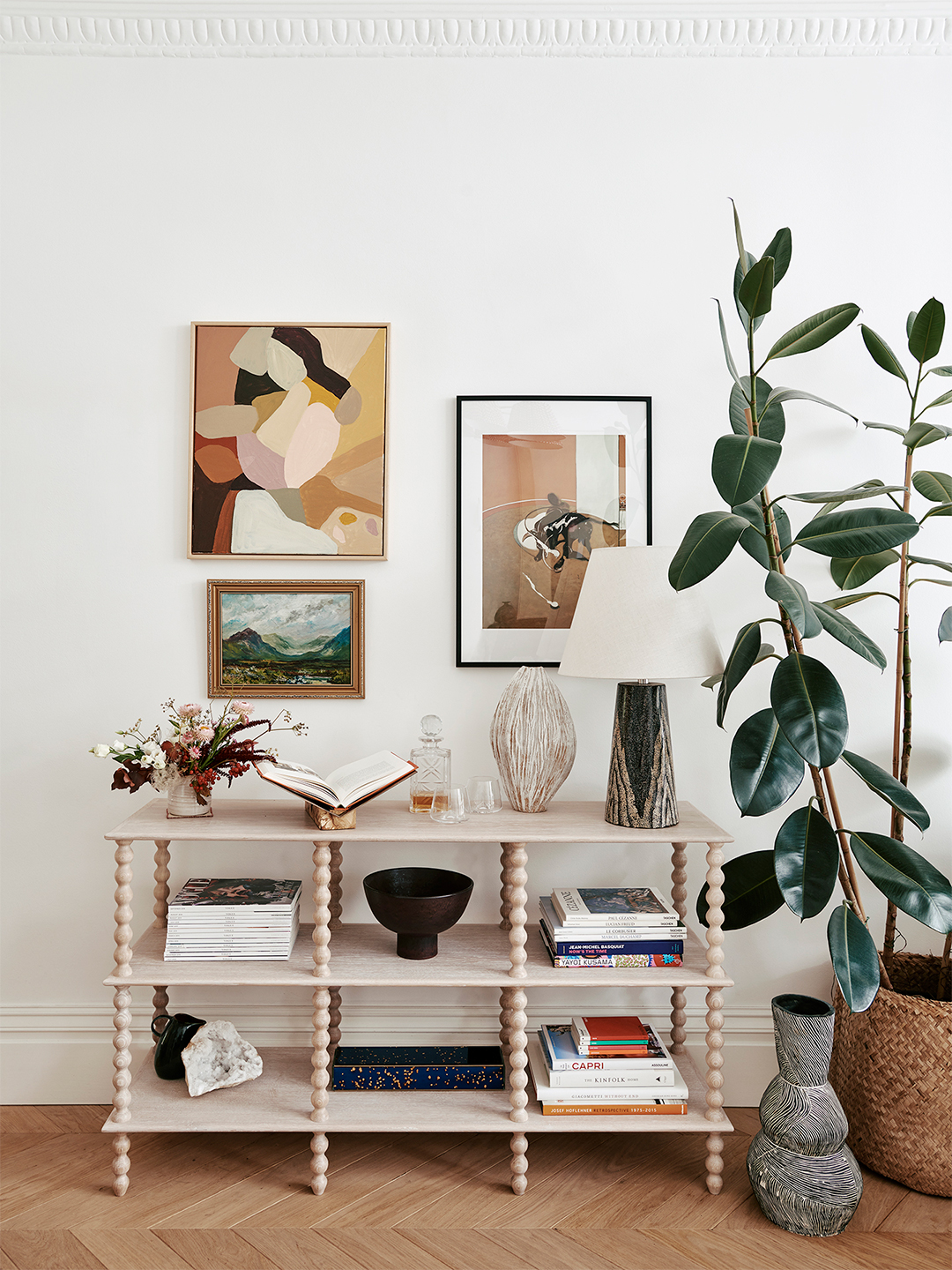 gallery wall above shelving