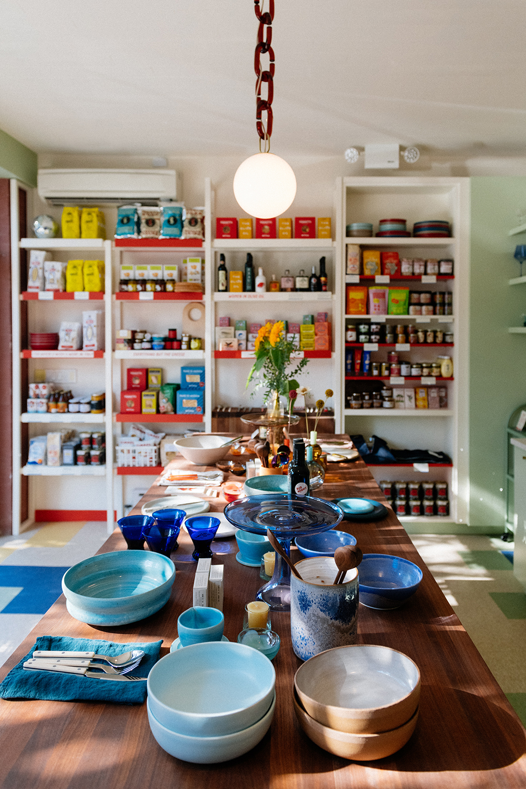 green and white painted store with dining essentials and tableware