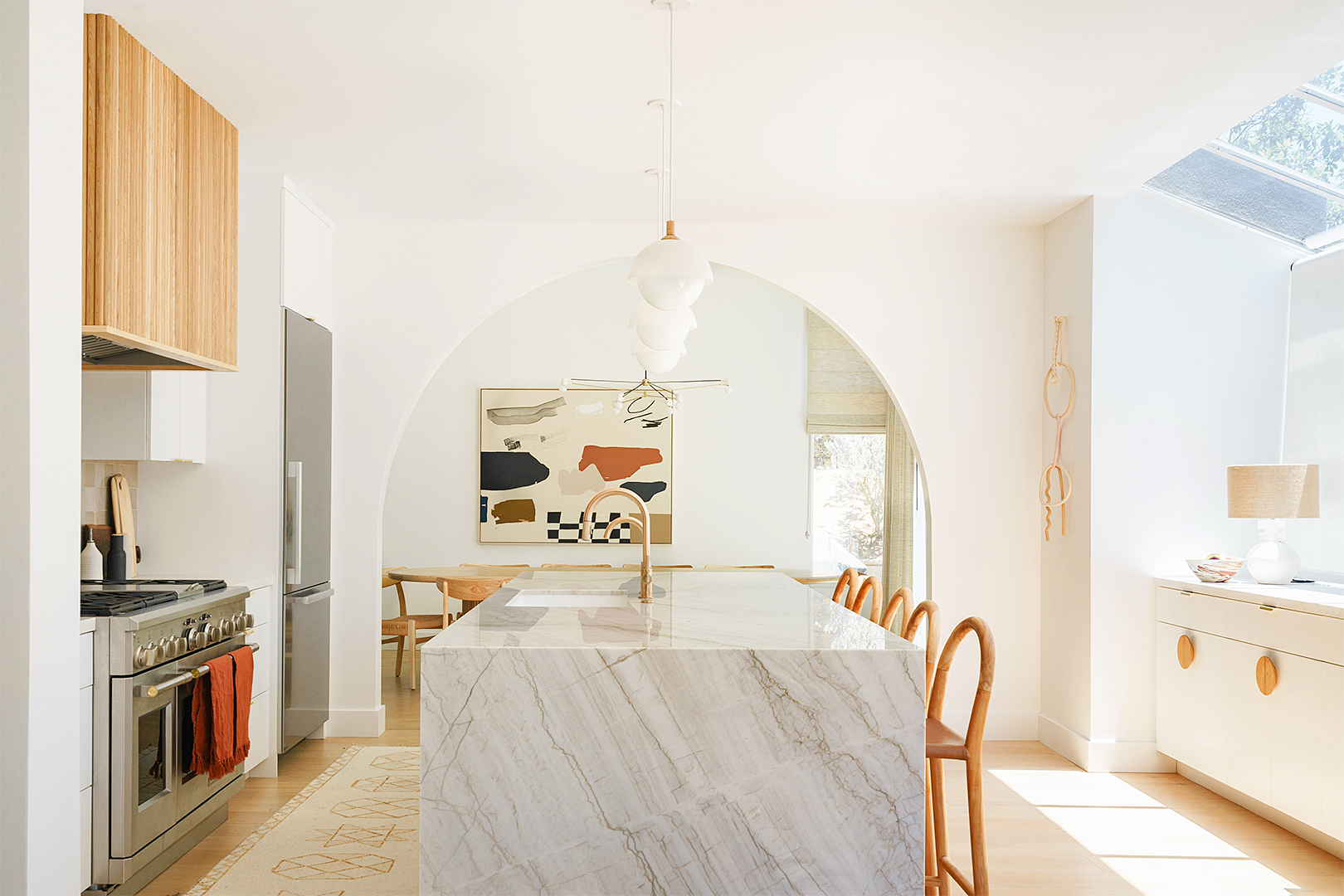 bright kitchen with stone island