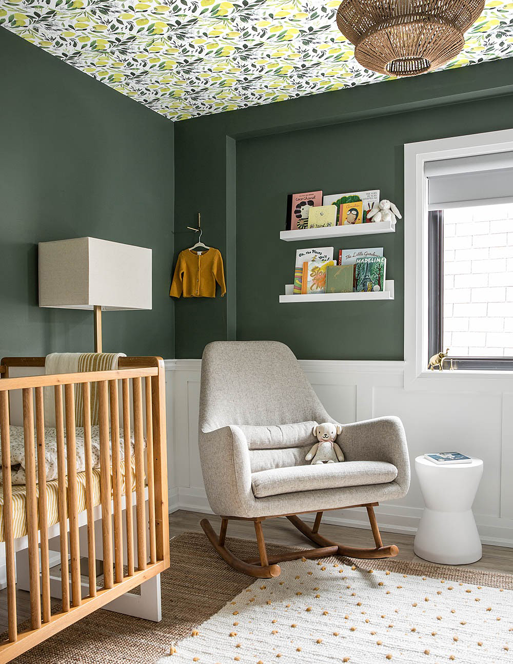 forest green nursery with wallpapered ceiling