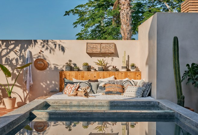 outdoor daybed next to pool