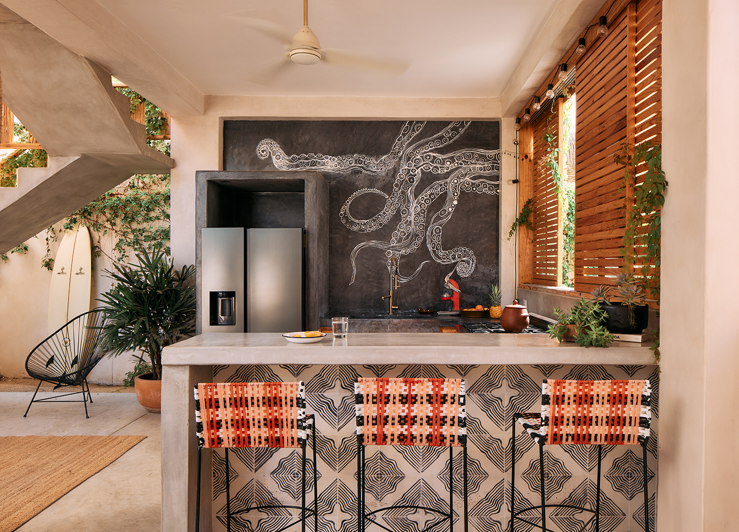 kitchen with red woven bar stools