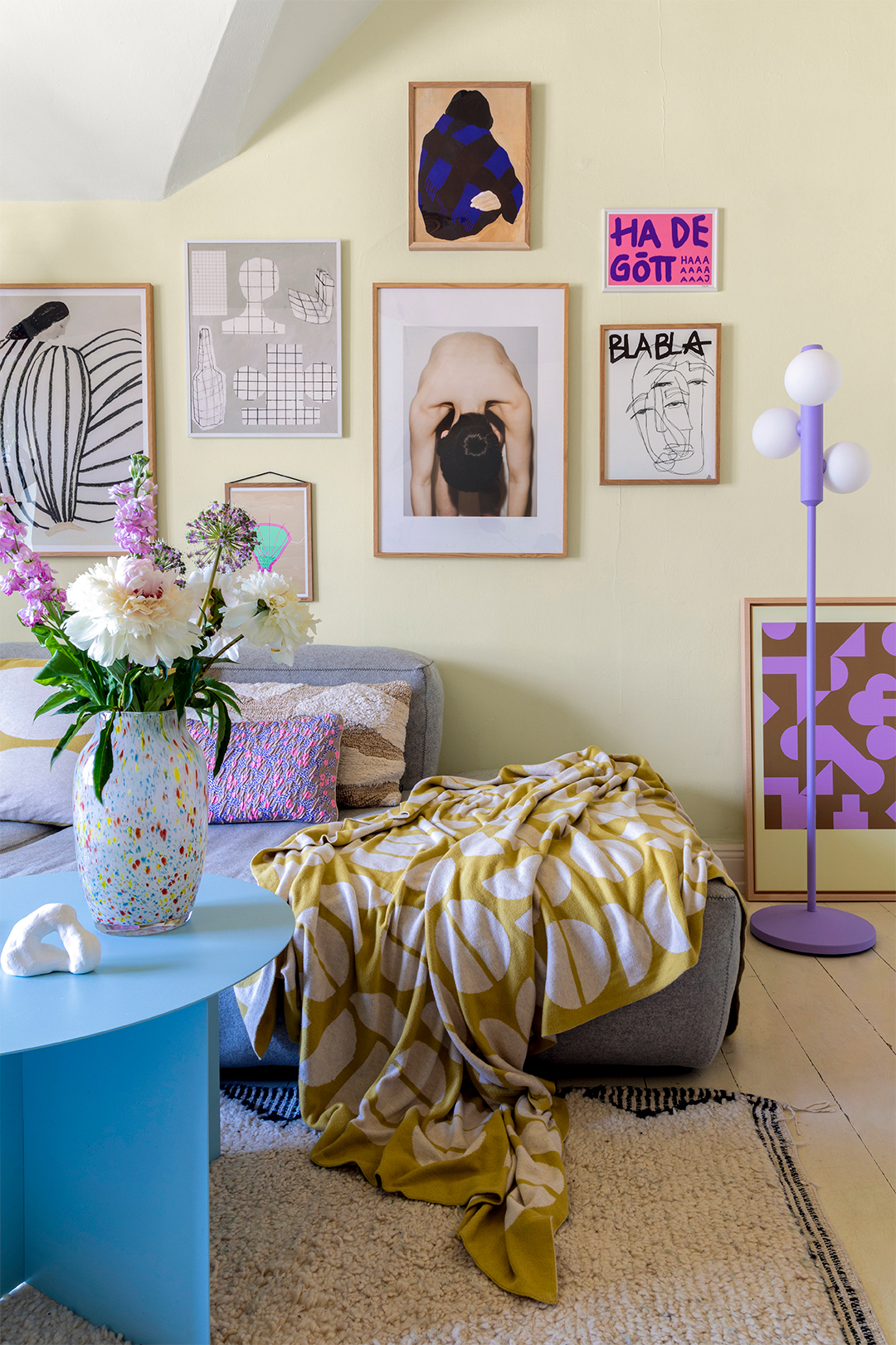 living room with grey sofa and yellow walls