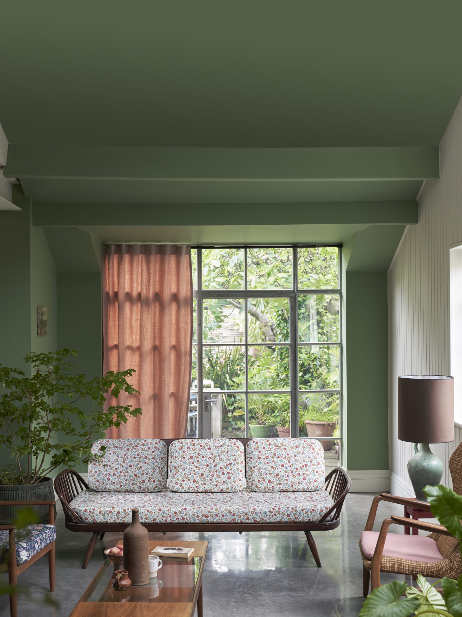 Green living room with large window