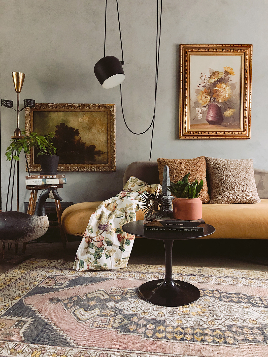 Living room with pendant lighting and black coffee table