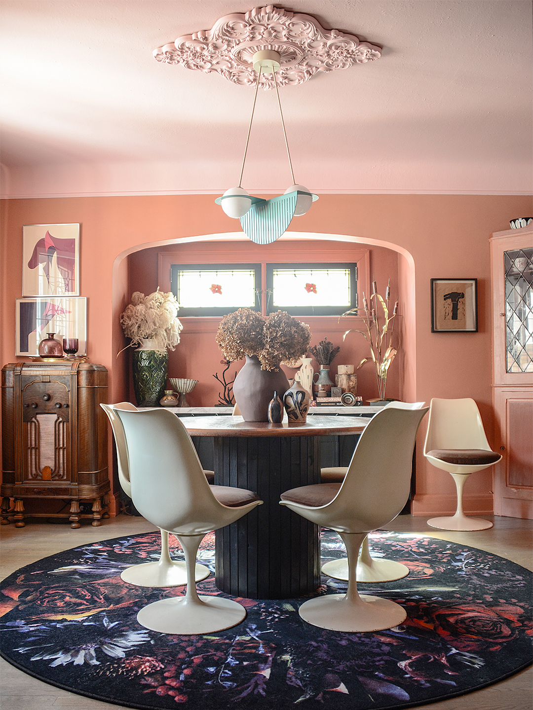 Dining room with coral colored walls