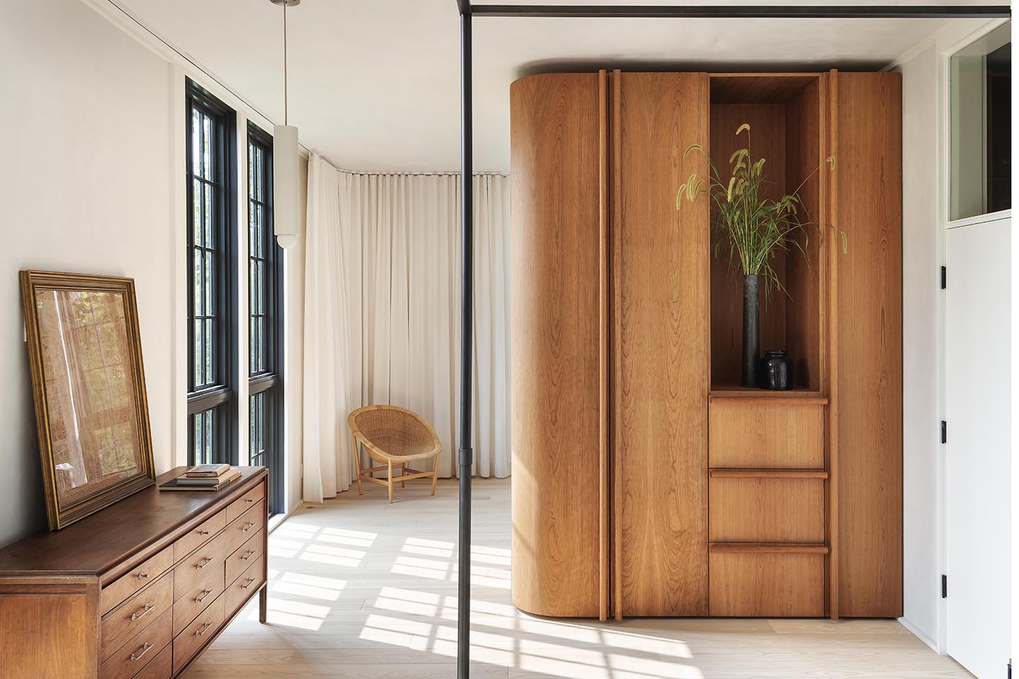 White bedroom with wood freestanding storage units