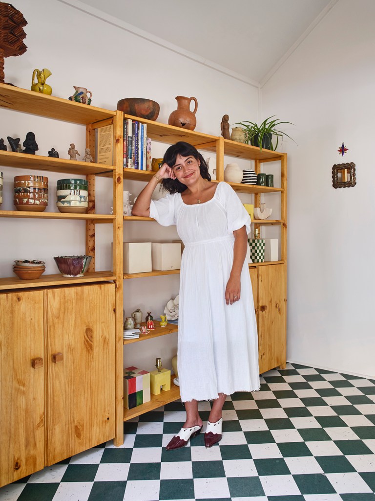 woman leaning on shelf