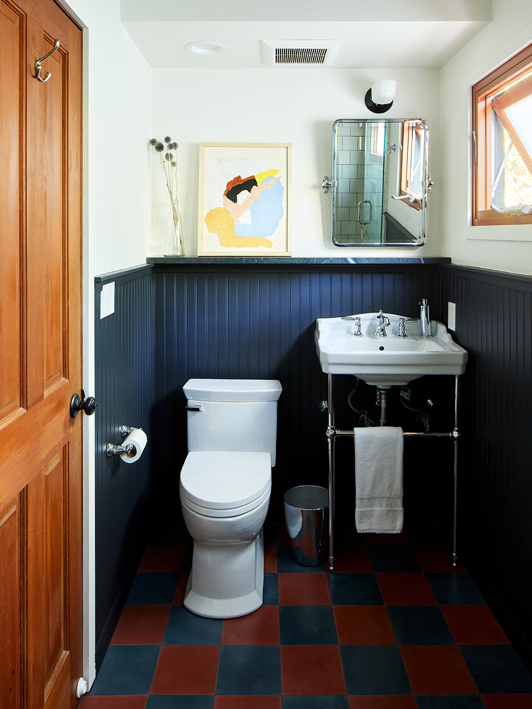 blue bathroom with checkered floors.