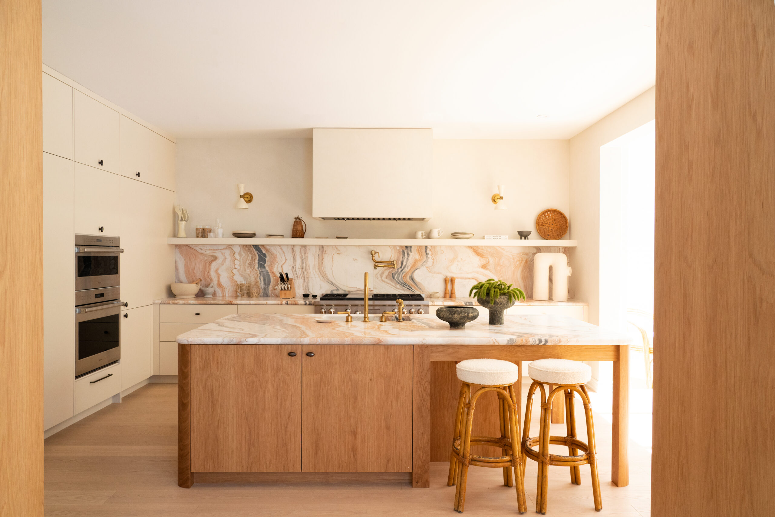 white kitchen with wood island