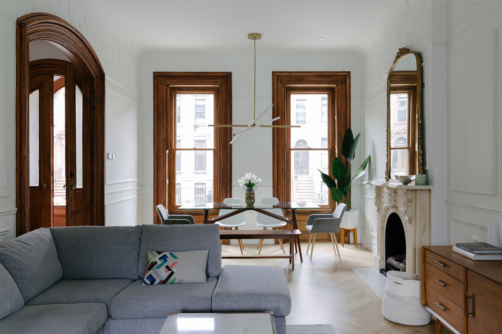 airy white living room with wood trim