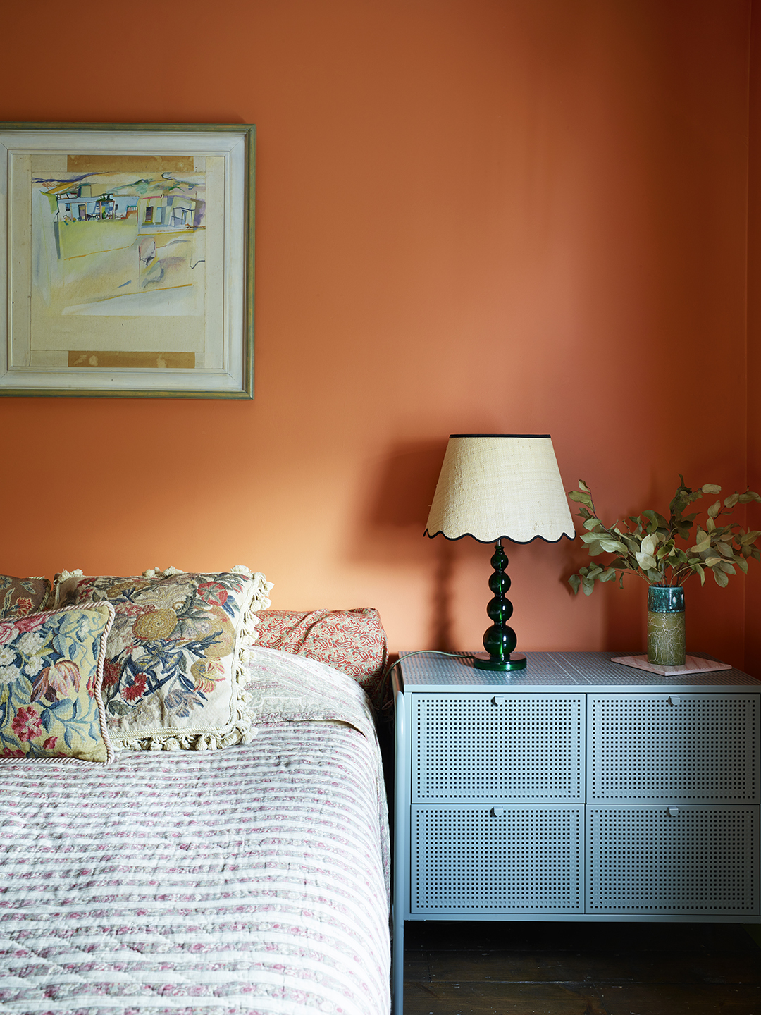 orange bedroom and blue side table