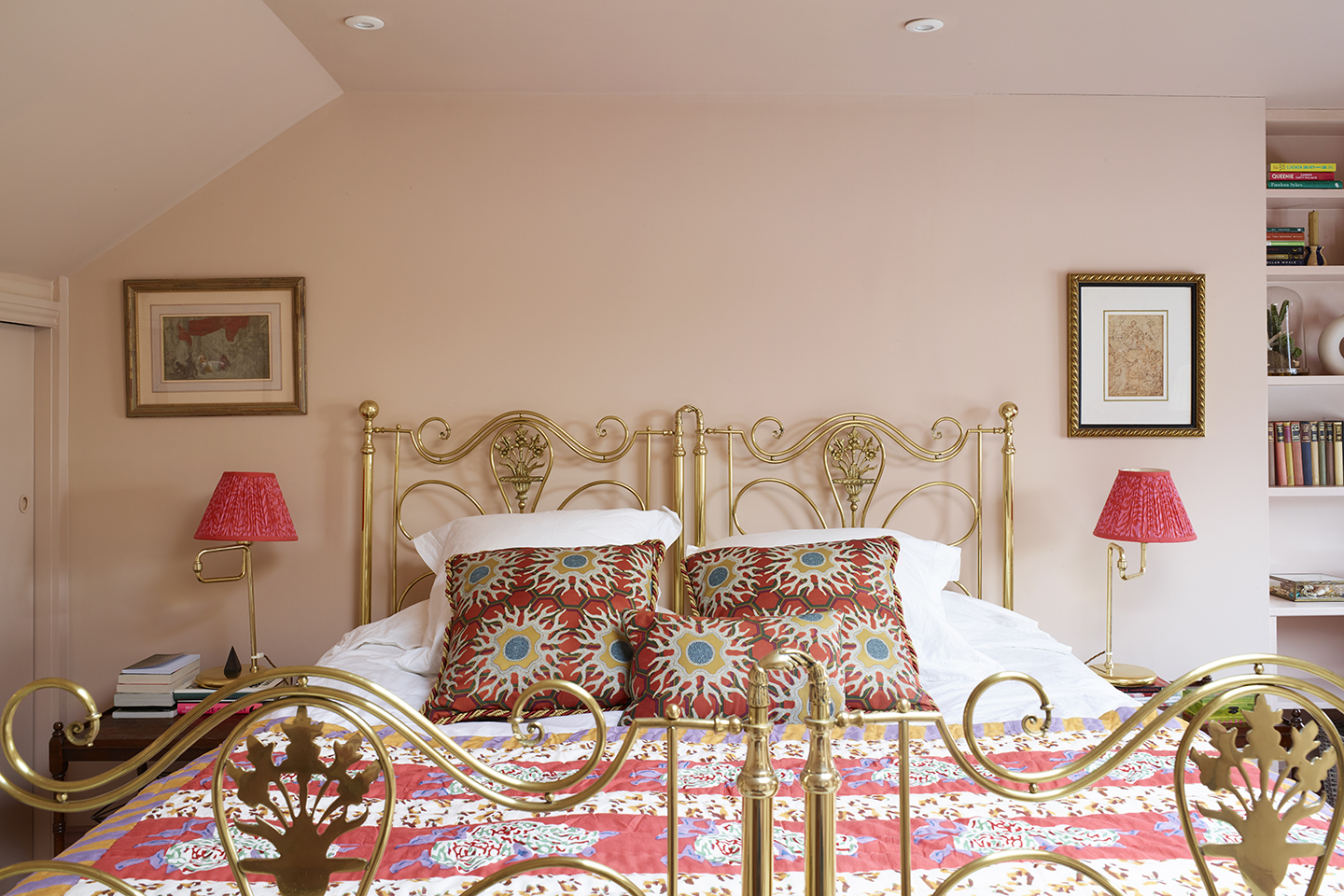 light pink bedroom with gold metal bed frame