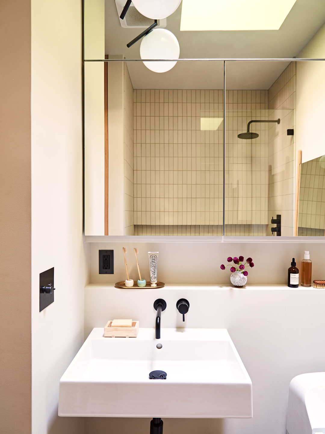 white sink with mirrored vanity