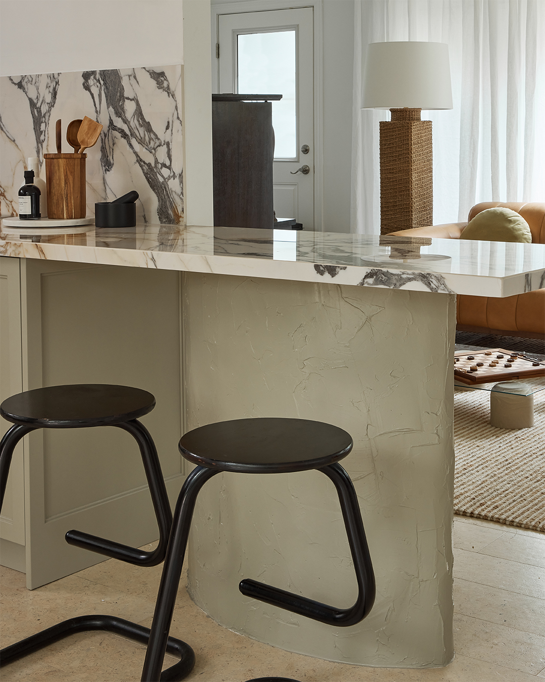 modern black stools at countertop