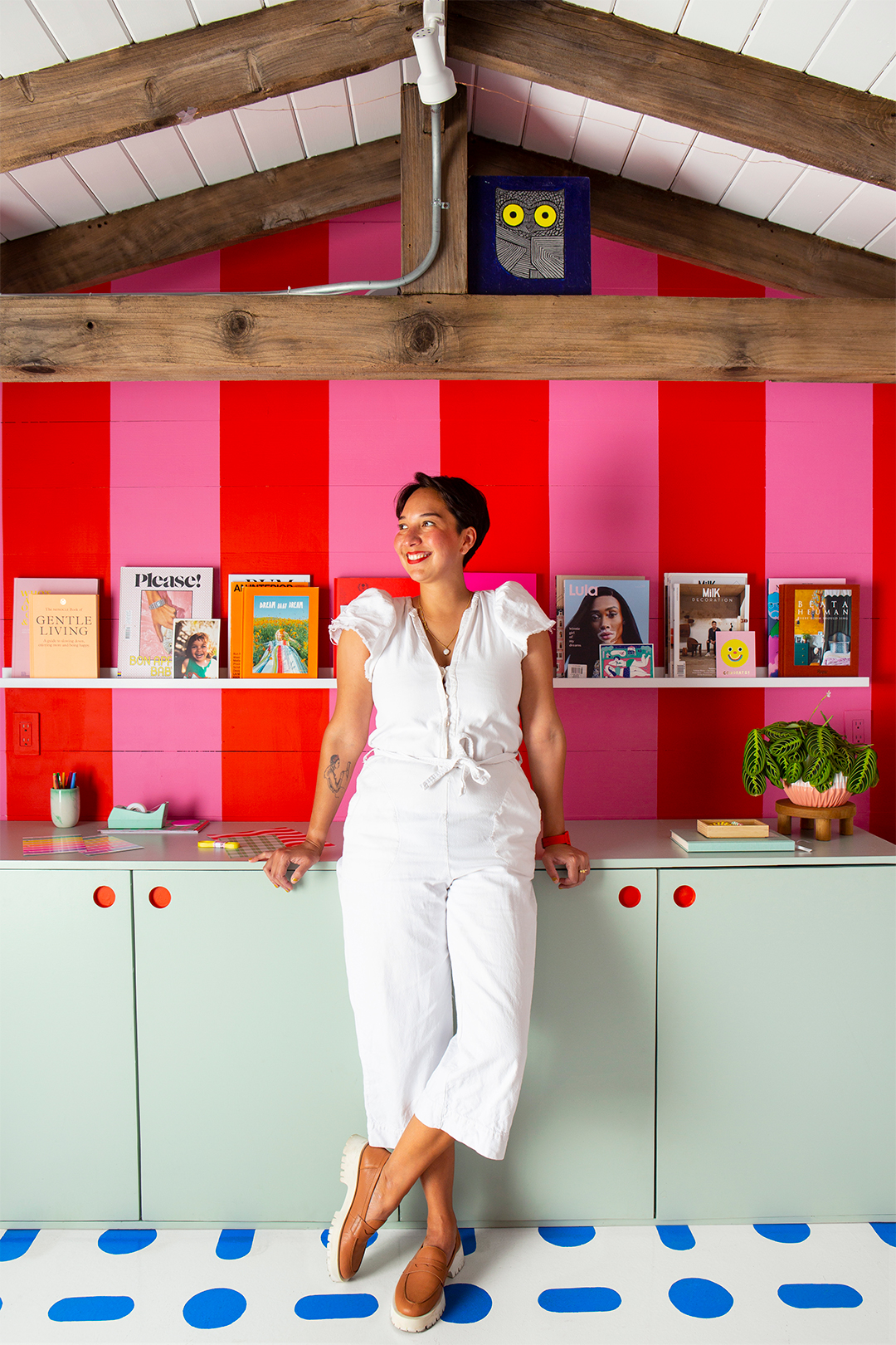 woman leaning on cabinets