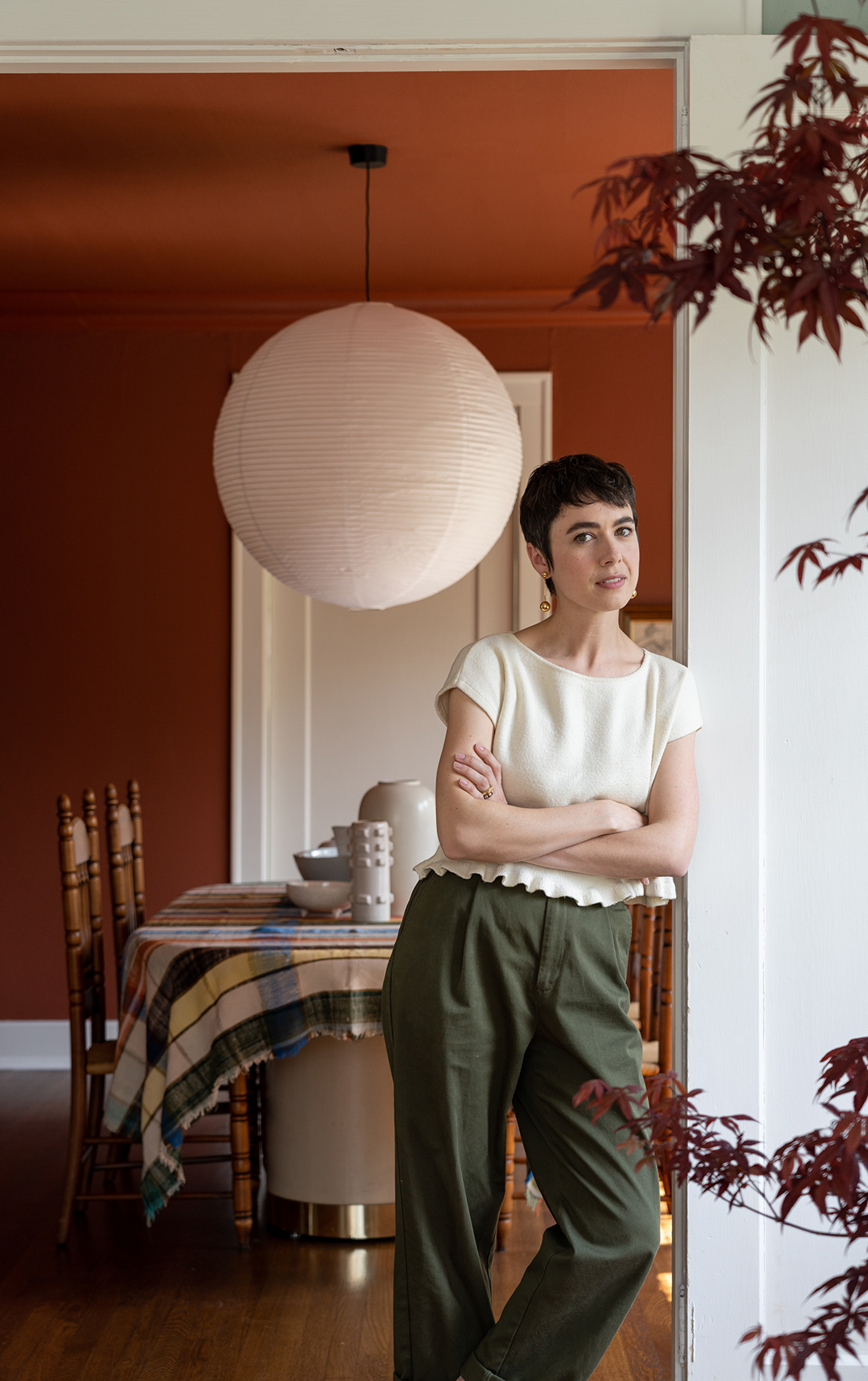 woman leaning on wall