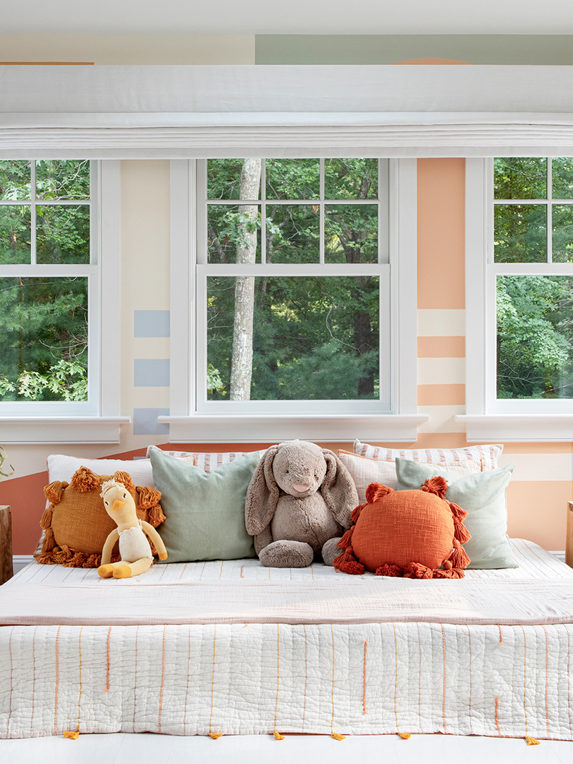 long day bed with stuffed animals