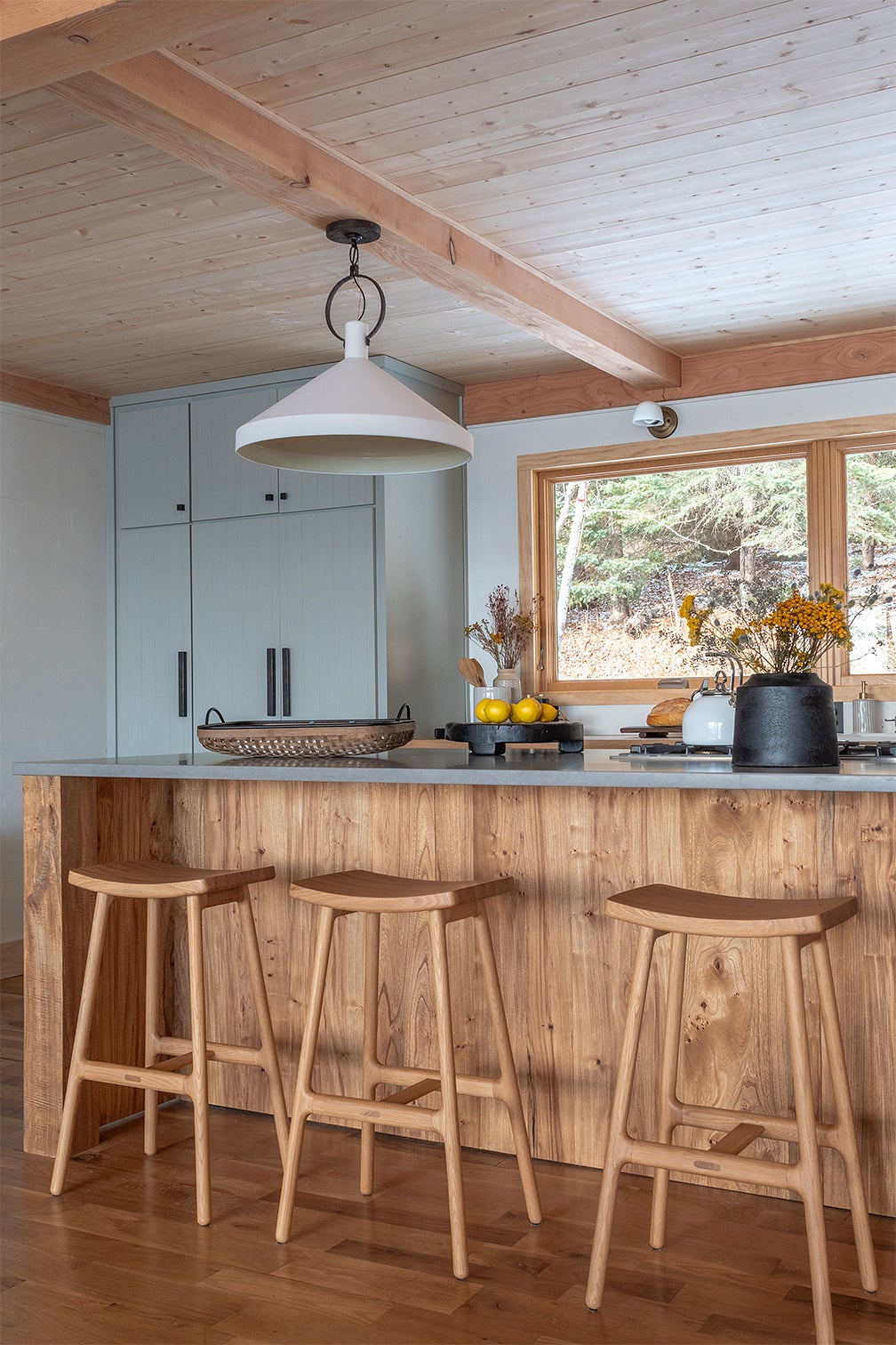 Wood Saddle Stools in Wood Kitchen