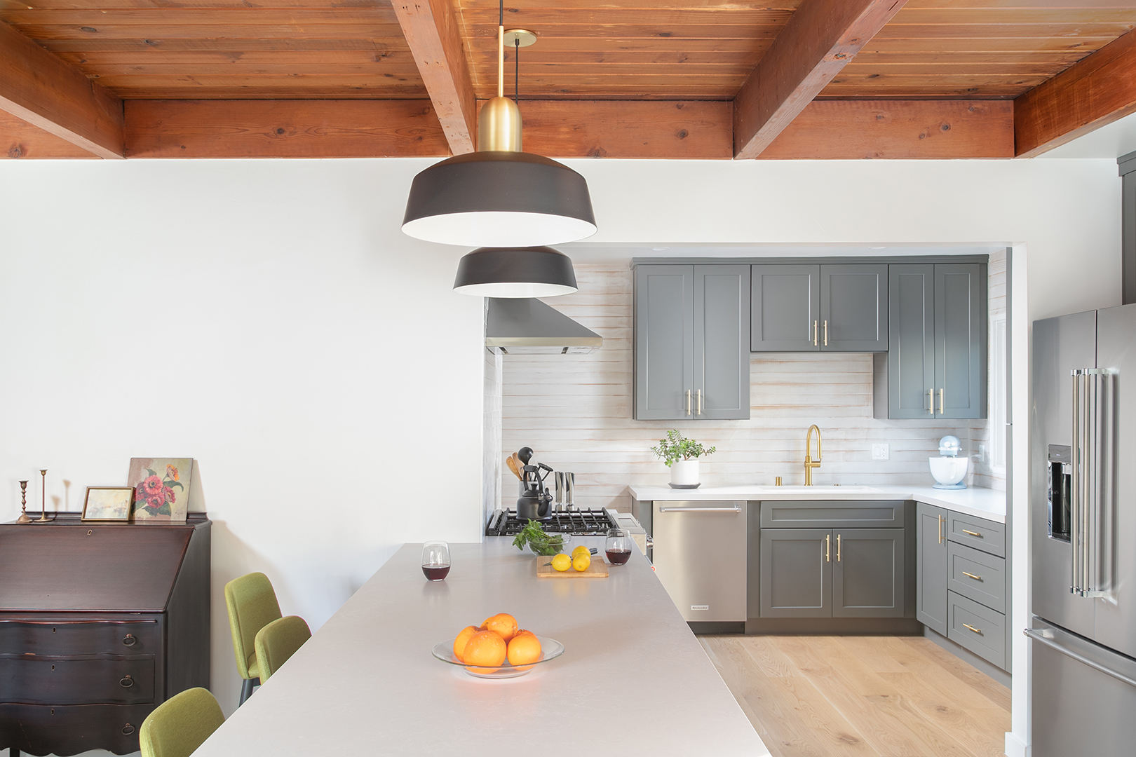 white kitchen with wood ceilings