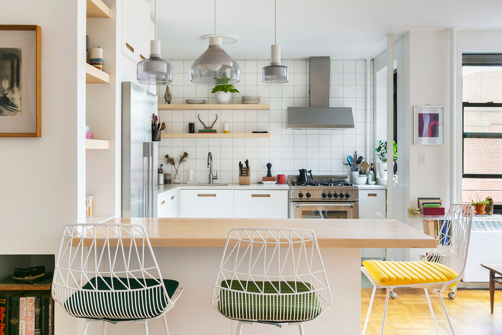 modern kitchen with white tile and peninsula