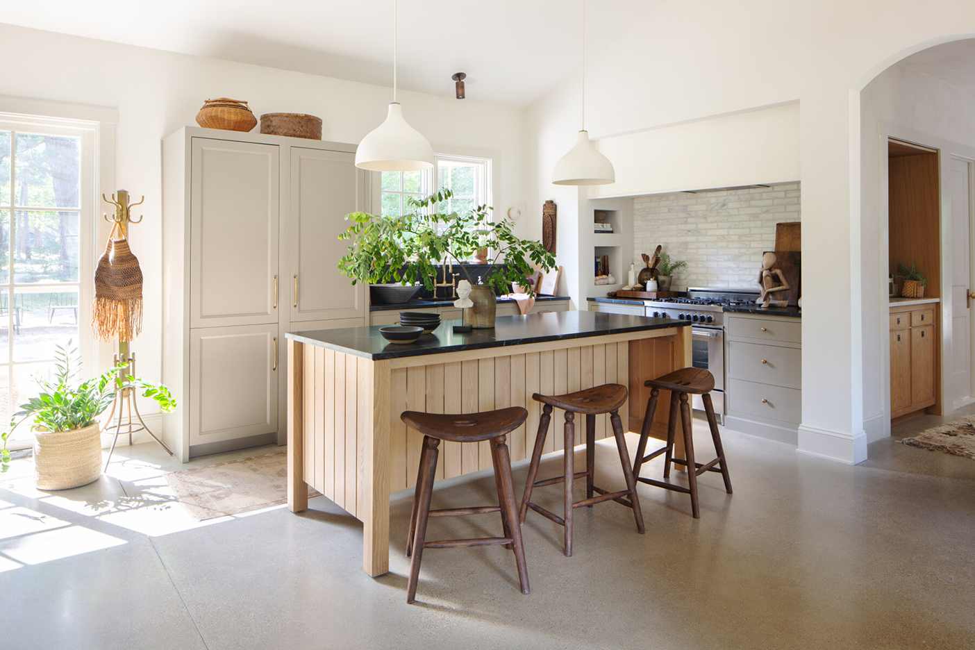 kitchen corner, white walls, black countertops