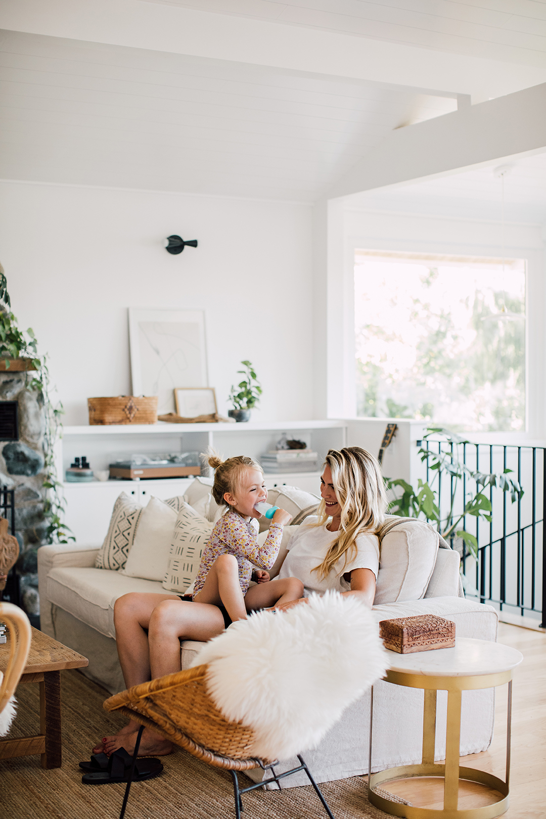 mother and daughter on sofa